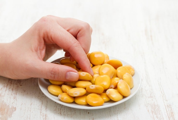 Salted lupins on white plate