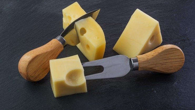 Three pieces of Jarlsberg cheese 
